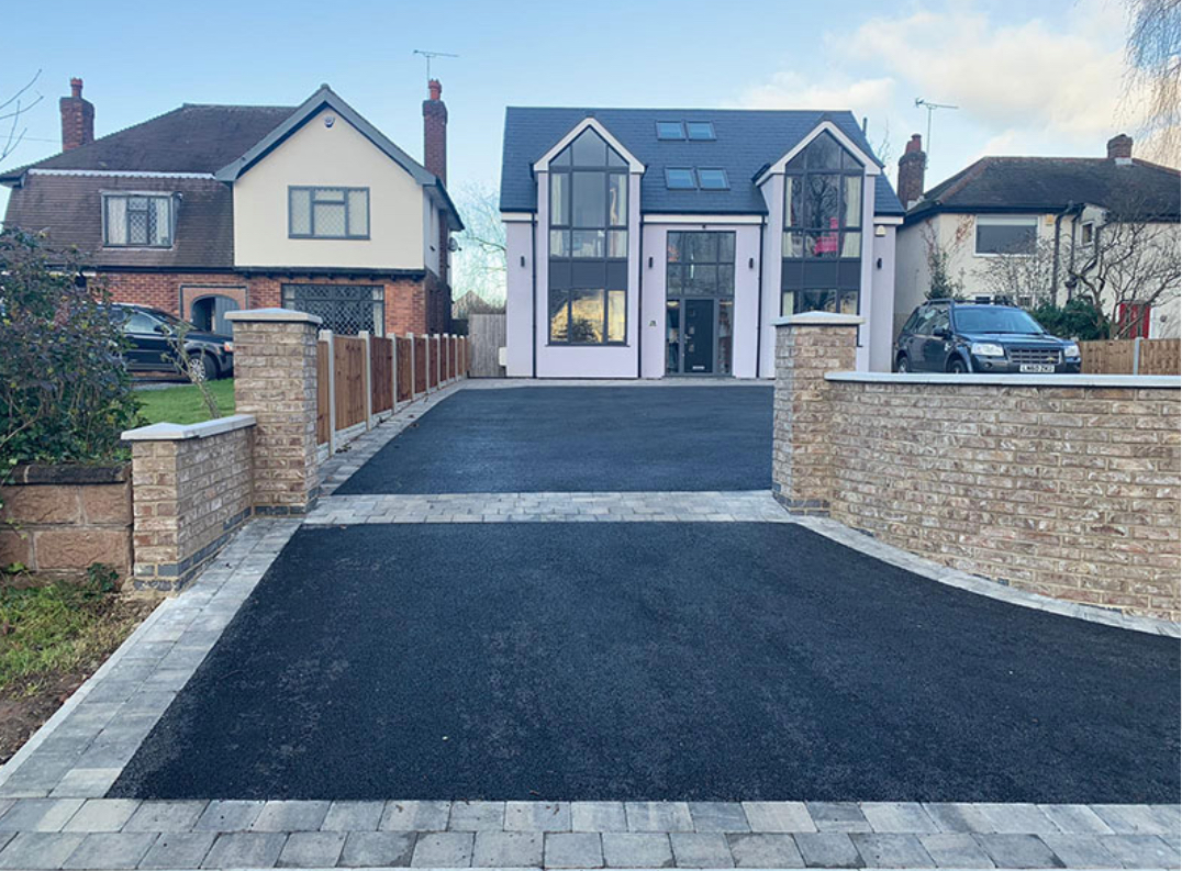 Completed tarmac driveway with a paved threshold in Cheshire